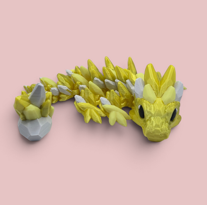 HST Media Designs yellow and white articulated 3D printed Glowstone dragon with gemstone-inspired details.